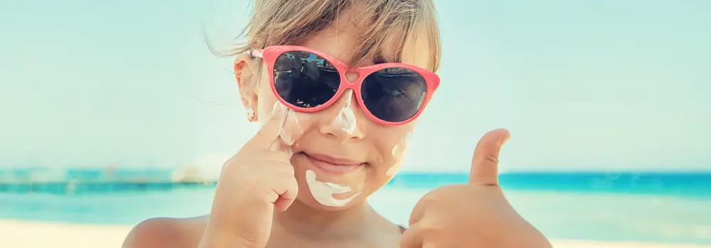 Sunscreen on the skin of a child. Selective focus.